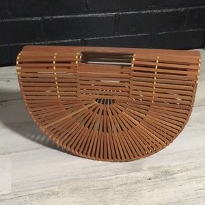 Bamboo see through half oval moon shaped unusual clutch bag.
